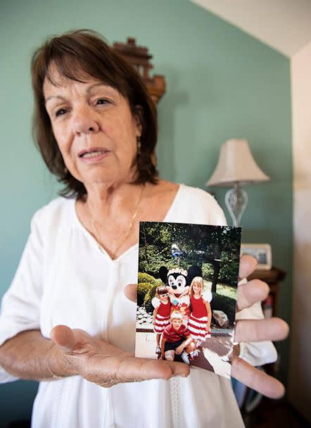 PHOTO: Denise Smart holds a favorite photo of her children, Kristin, Lindsey and Matt, May 24, 2023, at her home in Stockton, California. (Laura Dickinson/San Luis Obispo Tribune via Getty Images)