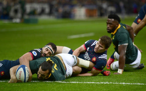 Dillyn Leyds scores a try for South Africa - Credit: AFP