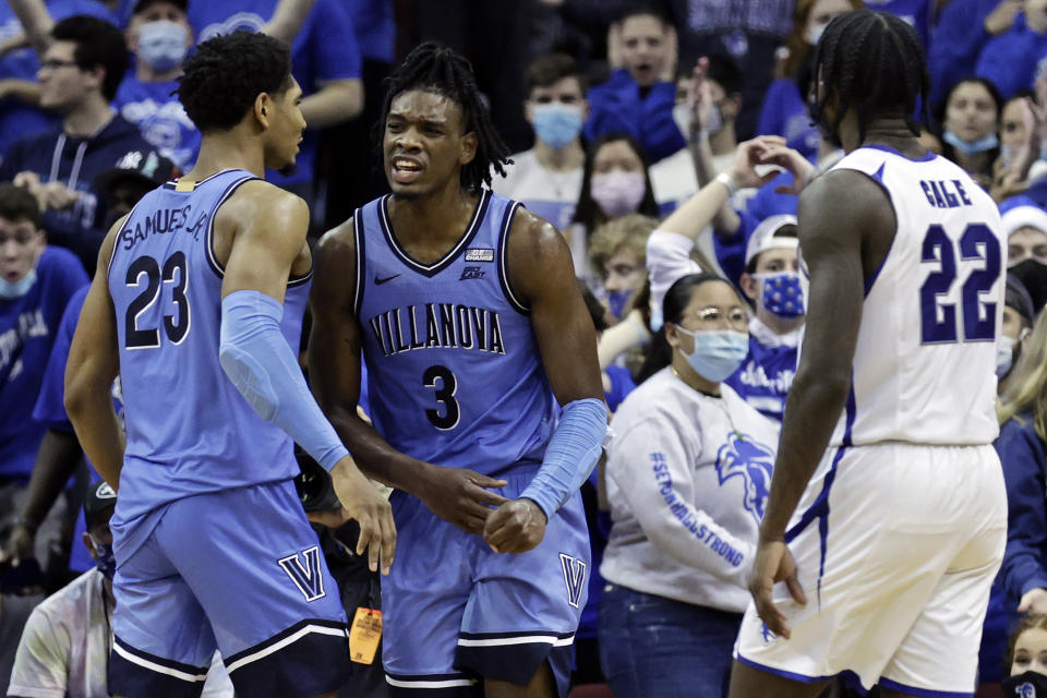 Villanova forward Brandon Slater (3) reacts after being fouled in front of Seton Hall guard Myles Cale (22) during the second half of an NCAA college basketball game Saturday, Jan. 1, 2022, in Newark, N.J. Villanova won 73-67. (AP Photo/Adam Hunger)