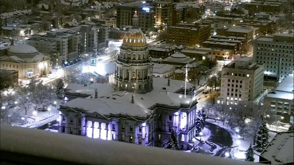 Please see this frame grab showing The Colorado State Capitol is covered in snow early Thursday, March 14, 2024 in Denver. A major snowstorm has hit Colorado, closing numerous schools and government offices Thursday and shutting down sections of highways leading to the Denver area as meteorologists warned of difficult to nearly impossible travel.
