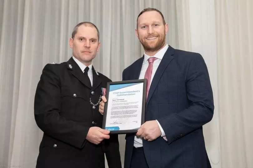 Plymouth police Chief Supt Matt Longman with Ryan Hammond who was one of two members of the public - including 17-year-old Niamh Taylor-May - who helped police tackle an armed suspect -Credit:Devon and Cornwall Police