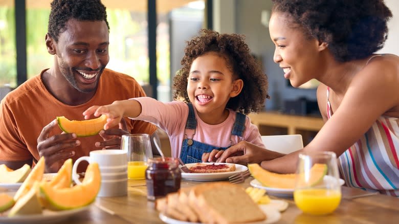 Family eating breakfast with toast