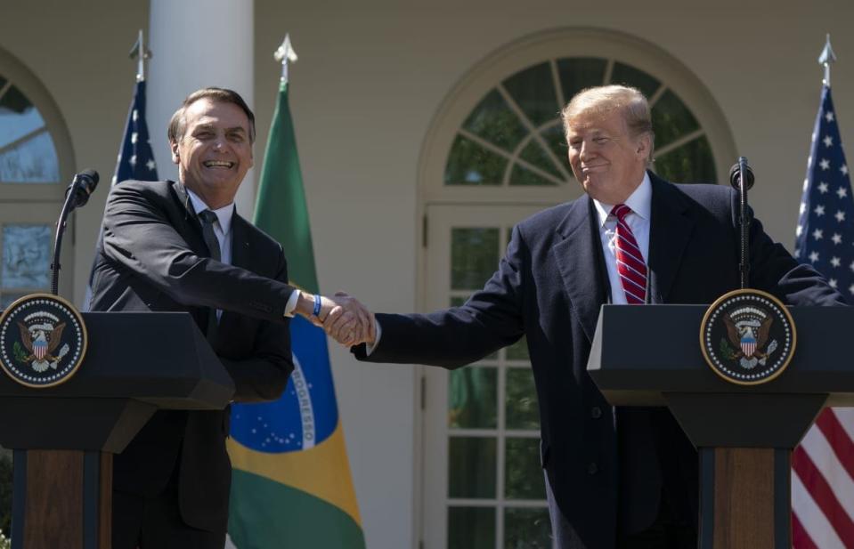 (AFP OUT) U.S. President Donald Trump and Brazilian President Jair Bolsonaro attend a joint news conference in the Rose Garden at the White House March 19, 2019 in Washington, DC. President Trump is hosting President Bolsonaro for a visit and bilateral talks at the White House today. (Photo by Chris Kleponis-Pool/Getty Images)
