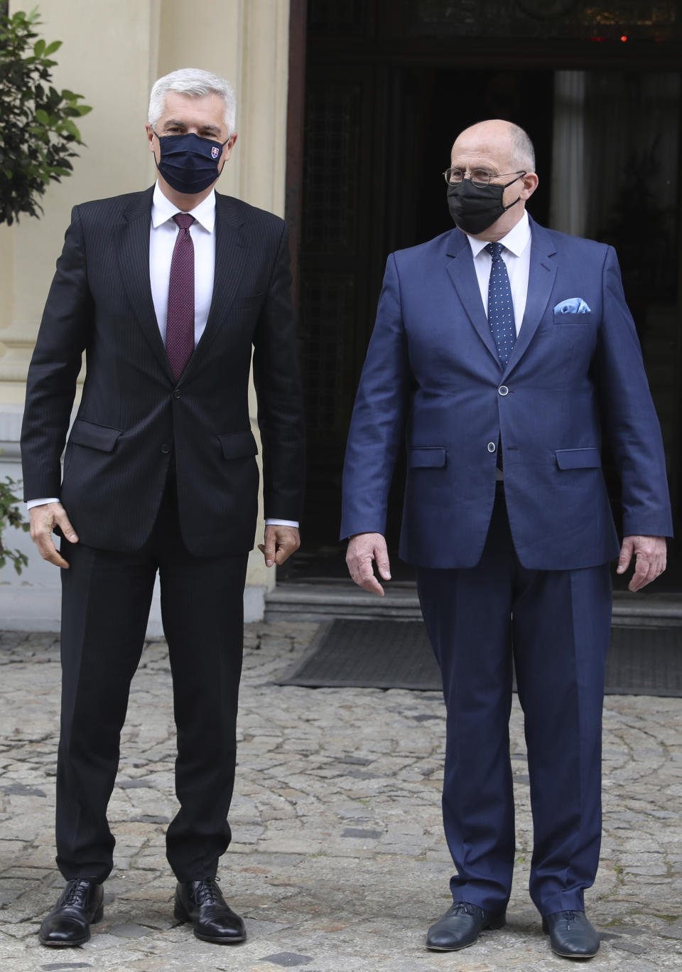 Poland's Foreign Minister Zbigniew Rau,right, gestures toward Slovak Foreign Minister Ivan Korcok, ahead of a meeting with regional counterparts in Lodz, Poland, Friday, May 14, 2021.(AP Photo/Czarek Sokolowski)