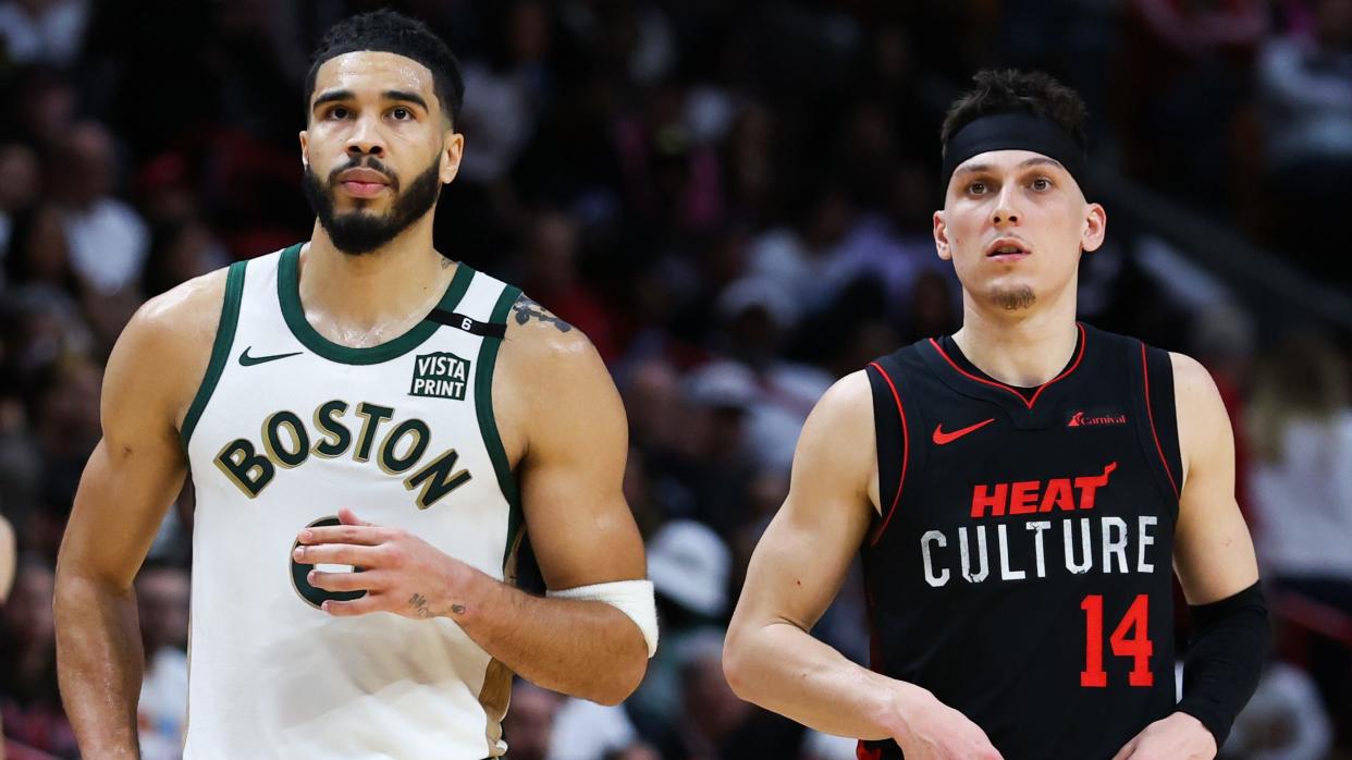 MIAMI, FLORIDA - FEBRUARY 11: Jayson Tatum #0 of the Boston Celtics and Tyler Herro #14 of the Miami Heat look on during the third quarter of the game at Kaseya Center on February 11, 2024 in Miami, Florida. NOTE TO USER: User expressly acknowledges and agrees that, by downloading and or using this photograph, User is consenting to the terms and conditions of the Getty Images License Agreement. (Photo by Megan Briggs/Getty Images)