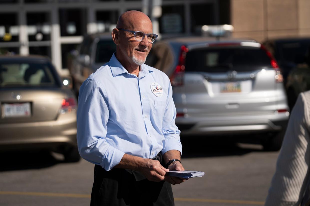 Joe Motil, who is challenging incumbent Andrew Ginther for Columbus mayor on the Nov. 7 general election ballot, hands out flyers Oct. 11, 2023, at the Franklin County Board of Elections on the first day of early voting.