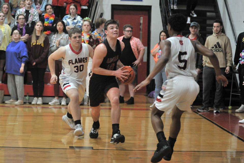 Lucas' Aiden Culler takes it strong to the hoop. Culler finished with a game-high 26 points.