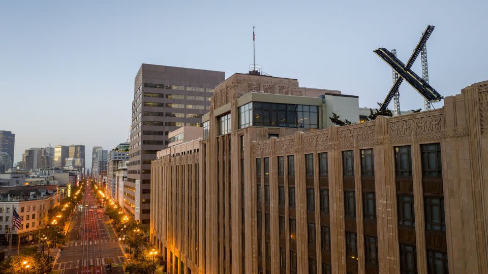 An aerial view shows a newly constructed X sign on the roof of the social media platform's headquarters in San Francisco, on July 29, 2023. - Josh Adelson/AFP/Getty Images