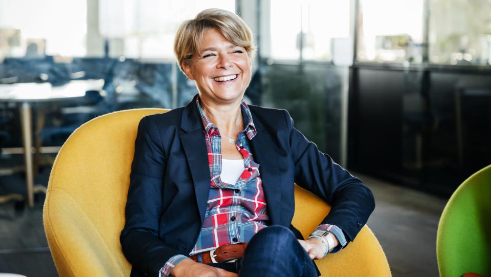 A woman sitting in a chair in an office, get your dream job