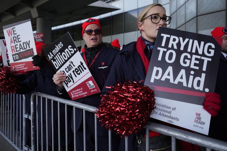 Flight attendants protest at O'Hare International Airport in Chicago, Tuesday, Feb. 13, 2024. Three separate unions representing flight attendants at major U.S. airlines are picketing and holding rallies at 30 airports on Tuesday as they push for new contracts and higher wages. (AP Photo/Nam Y. Huh)