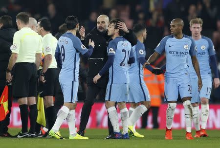 Britain Football Soccer - AFC Bournemouth v Manchester City - Premier League - Vitality Stadium - 13/2/17 Manchester City manager Pep Guardiola celebrates with David Silva and Nolito after the game Action Images via Reuters / Matthew Childs