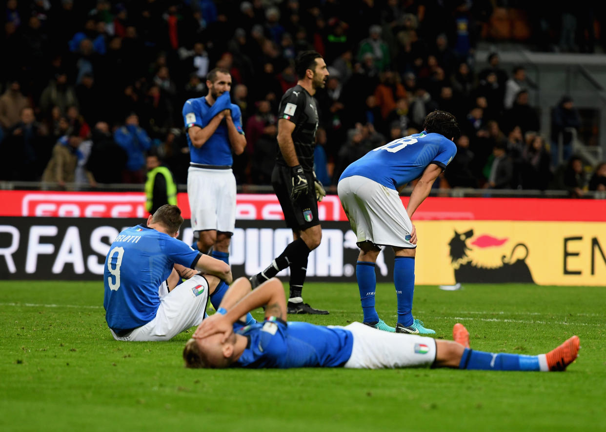 Italy players lie on the San Siro pitch and rue their failure to qualify for the 2018 World Cup. (Getty)