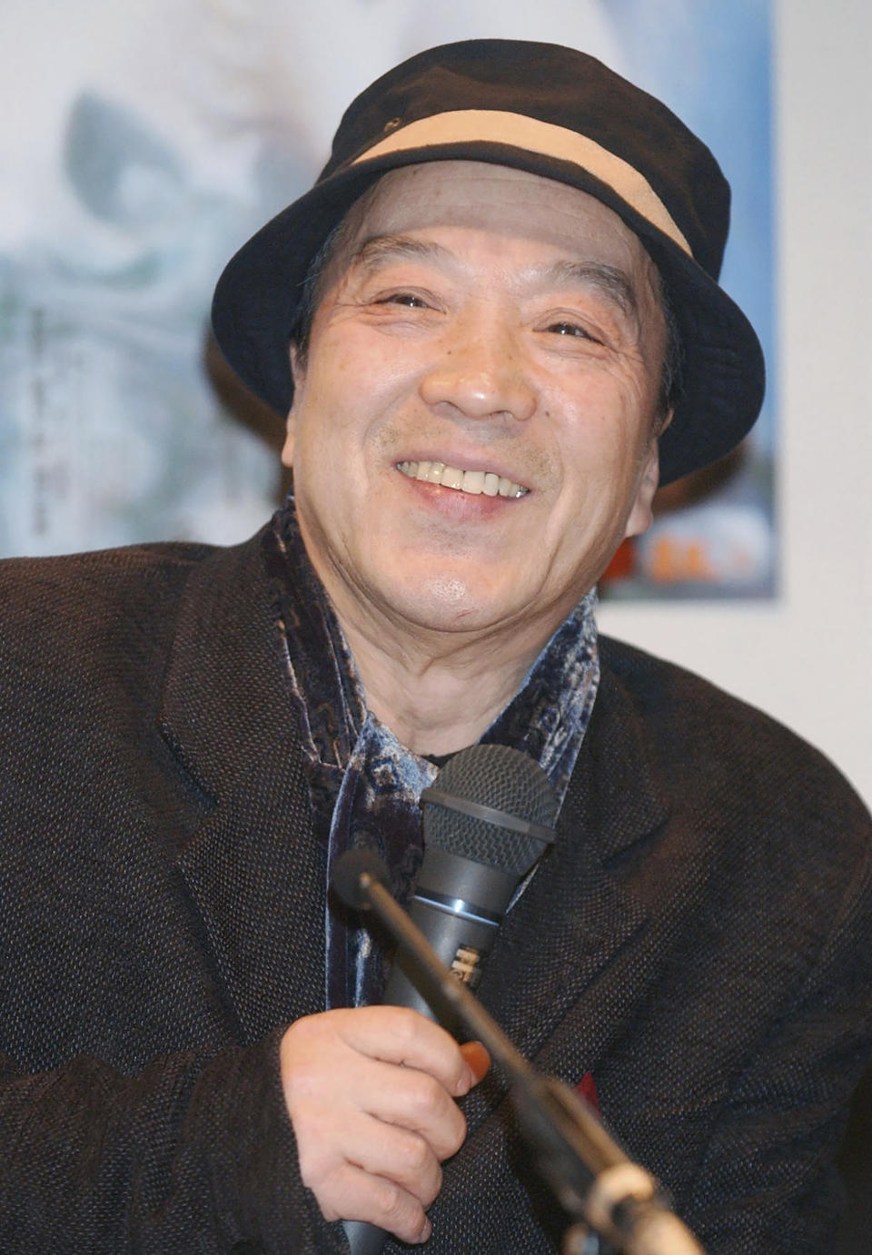 Juro Kara speaks during a press conference in Osaka, western Japan in March, 2005 after he was appointed as a guest professor at a university. The playwright, director and troupe leader died late Saturday from a blood clot in the brain after he collapsed at home and was rushed to a Tokyo hospital on May 1, his theater group Karagumi said in a statement on Sunday, May 5, 2024. He was 84. (Kyodo News via AP)