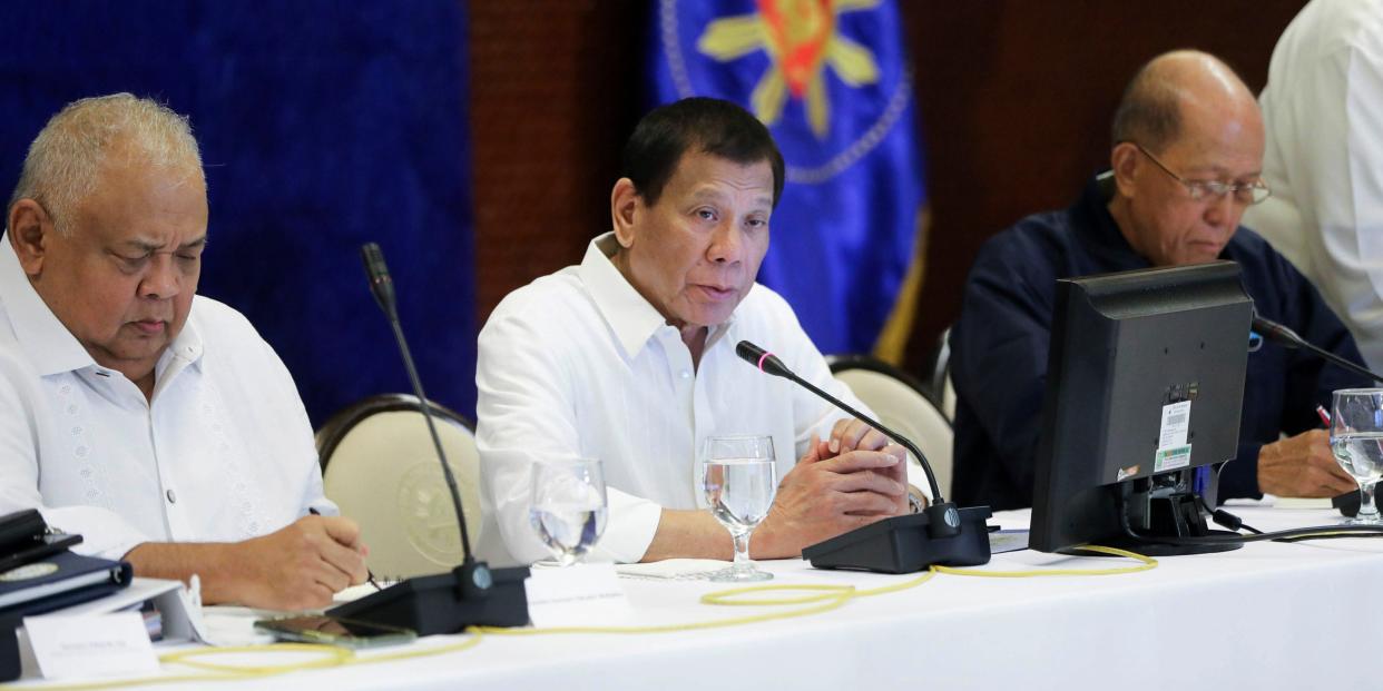 In this Jan. 7, 2020, photo provided by the Malacanang Presidential Photographers Division, Philippine President Rodrigo Duterte, center, talks during the Joint Armed Forces of the Philippines-Philippine National Police (AFP-PNP) Command Conference at the Malacanang presidential palace in Manila, Philippines. The Philippine government has ordered the mandatory evacuation of Filipino workers from Iraq and is sending a coast guard vessel to the Middle East to rapidly ferry its citizens to safety in case hostilities between the United States and Iran worsen, officials said Wednesday. (Alfred Frias/ Malacanang Presidential Photographers Division via AP)