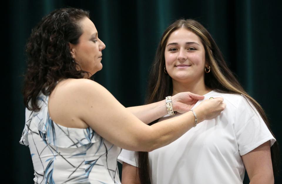 Nursing graduates receive their pins during the nurse pinning and lamp ceremony Thursday, Aug. 3, 2023, at Shelton State.