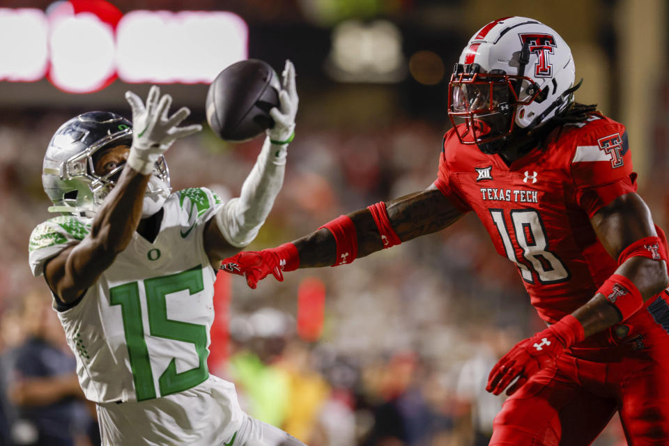 Texas Tech defensive back Tyler Owens (18) defends on an incomplete pass to Oregon wide receiver Tez Johnson (15) during the second half half of an NCAA college football game Saturday, Sept. 9, 2023, in Lubbock, Texas. (AP Photo/Chase Seabolt)