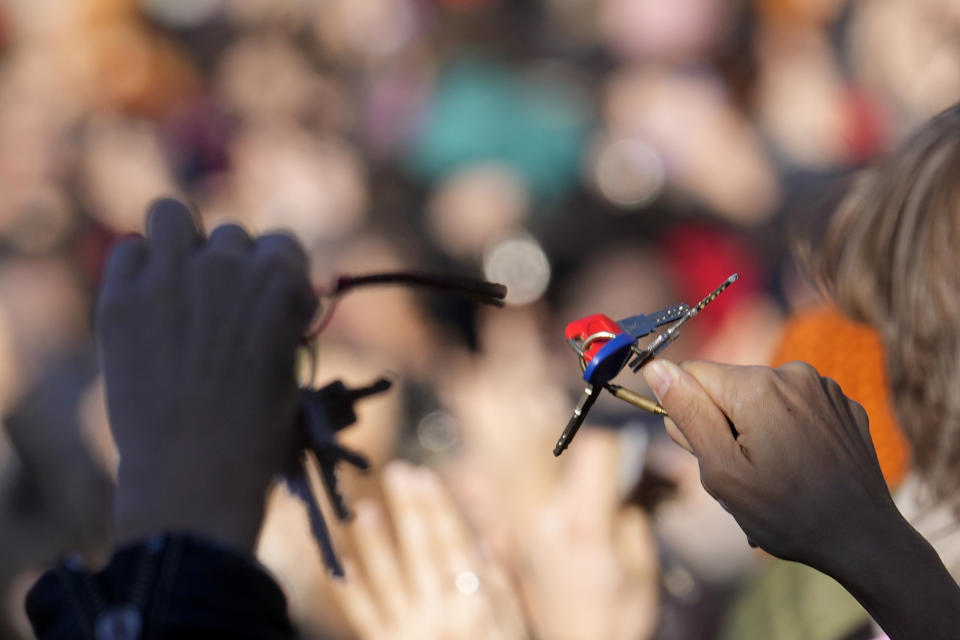 Women show keys as they gather on the occasion of International Day for the Elimination of Violence against Women, in Milan, Italy, Saturday, Nov.25, 2023. Thousands of people are expected to take the streets in Rome and other major Italian cities as part of what organizers call a "revolution" under way in Italians' approach to violence against women, a few days after the horrifying killing of a college student allegedly by her resentful ex-boyfriend sparked an outcry over the country's "patriarchal" culture. (AP Photo/Luca Bruno)