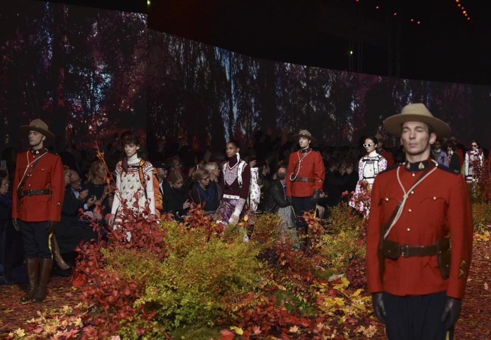 Models wear creations for Moncler Gamme Rouge Fall-Winter 2017/2018 ready-to-wear fashion collection presented Tuesday, March 7, 2017 in Paris. (AP Photo/Zacharie Scheurer)