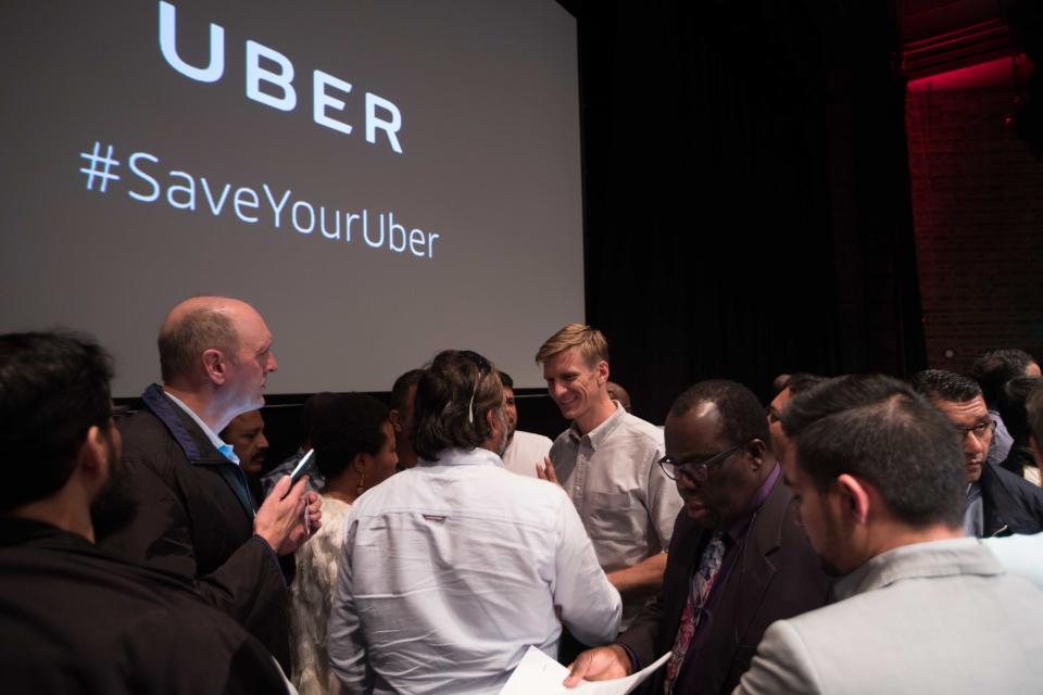 EDITORIAL USE ONLY Tom Elvidge, General Manager of Uber in London, answers questions at an event in central London for Uber drivers following TfL's decision to not renew the taxi app&Otilde;s licence in London.