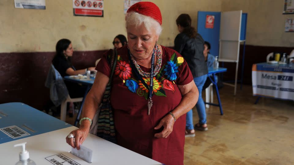A woman casts her vote at a polling station during the presidential run-off election in Guatemala City, Guatemala, on August 20, 2023. - Cristina Chiquin/Reuters