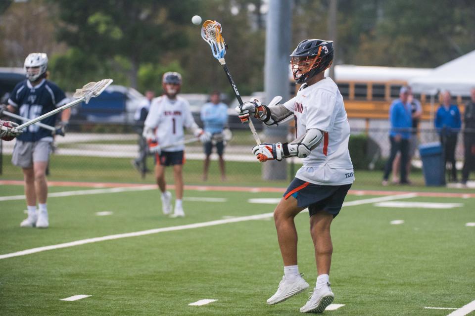 Benjamin midfielder Jayden Vega (3) passes the ball during the District 8-1A boys lacrosse championship game between St. Edward's and host Benjamin on Thursday, April 13, 2023, in Palm Beach Gardens, Fla. Final score, Benjamin, 12, St. Edward's, 9.