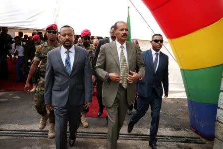 Eritrea's President Isaias Afwerki and Ethiopia's Prime Minister, Abiy Ahmed arrive for an inauguration ceremony marking the reopening of the Eritrean embassy in Addis Ababa, Ethiopia July 16, 2018. REUTERS/Tiksa Negeri