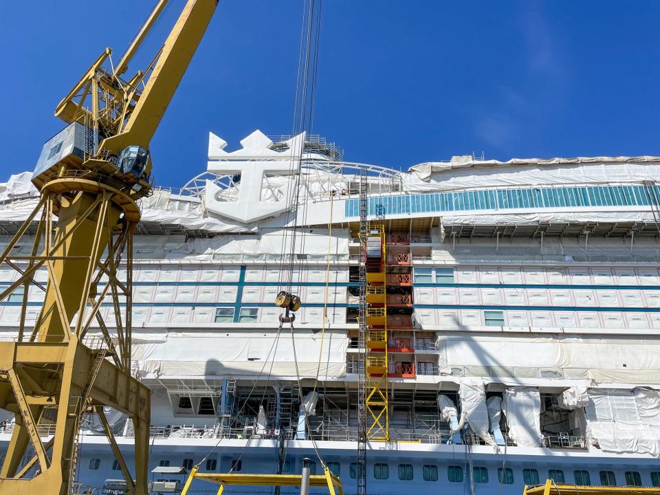 Royal Caribbean's Icon of the Seas under construction. There's a crane.