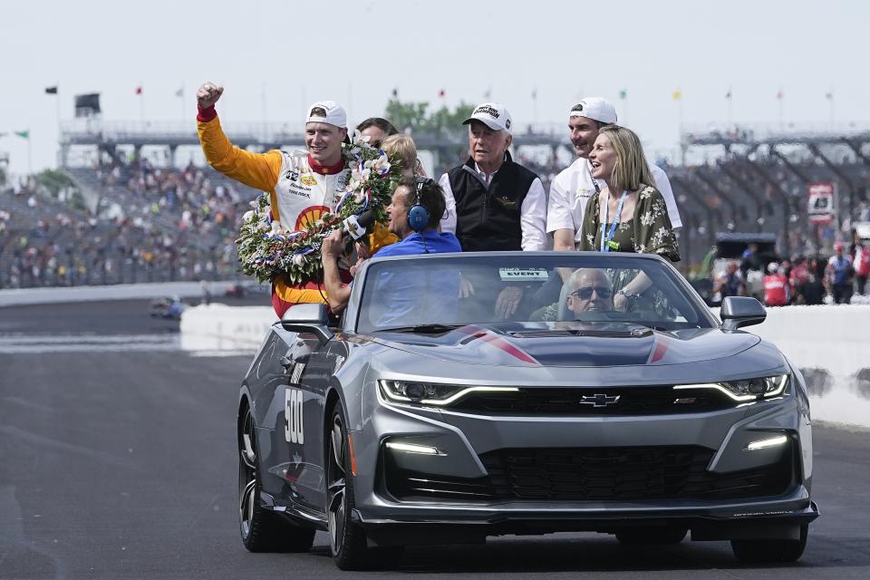 Josef Newgarden, left, reacts to the crowd after winning the Indianapolis 500 auto race at Indianapolis Motor Speedway, Sunday, May 28, 2023, in Indianapolis. (AP Photo/Darron Cummings)