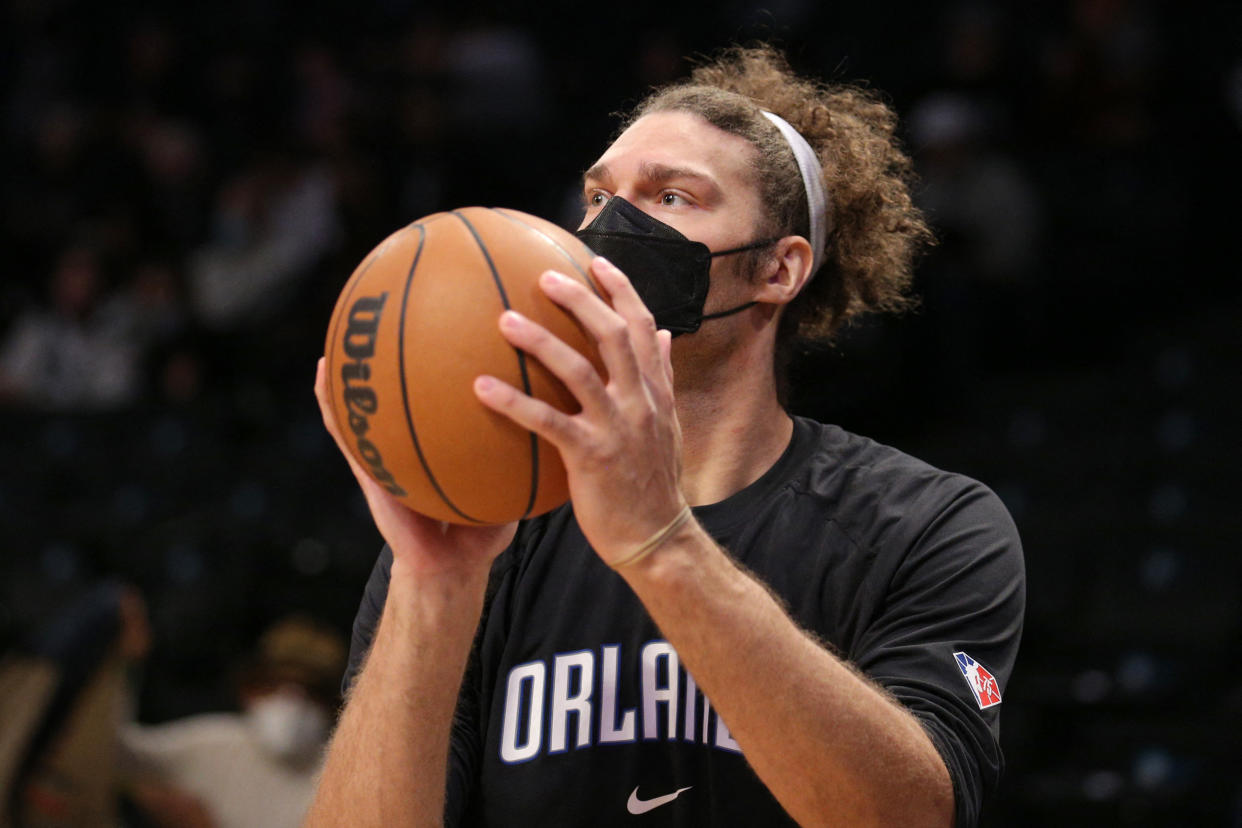 Dec 18, 2021; Brooklyn, New York, USA; Orlando Magic center Robin Lopez (33) wears a mask as he warms up before a game against the Brooklyn Nets at Barclays Center. Mandatory Credit: Brad Penner-USA TODAY Sports