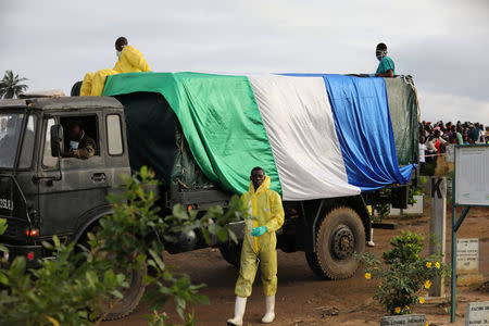 Trucks convey the remains of victims of the mudslide for burial at the Paloko cemetery, in Waterloo, Sierra Leone August 17, 2017. REUTERS/Afolabi Sotunde