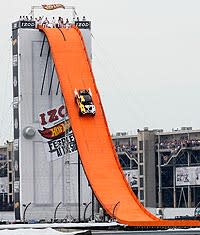 Tanner Foust rolls down a specially built ramp in the infield at Indianapolis Motor Speedway