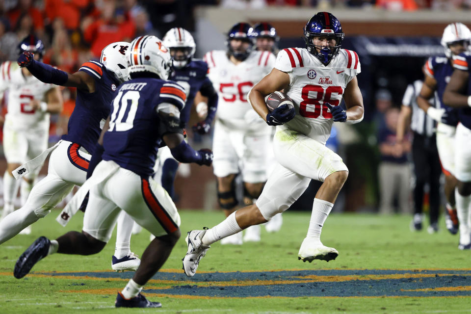 Mississippi tight end Caden Prieskorn (86) carries the ball against Auburn during the first half of an NCAA college football game, Saturday, Oct. 21, 2023, in Auburn, Ala. (AP Photo/ Butch Dill )