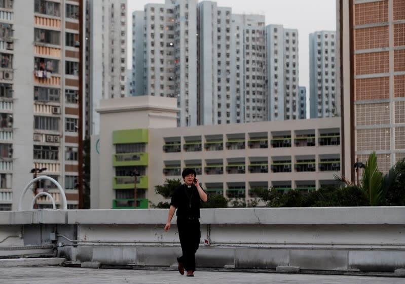 The Wider Image: Sermons with saline: Hong Kong pastor offers aid and prayers