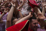 <p>Revellers enjoy the atmosphere during the opening day or ‘Chupinazo’ of the San Fermin Running of the Bulls fiesta on July 6, 2018 in Pamplona, Spain. The annual Fiesta de San Fermin, made famous by the 1926 novel of US writer Ernest Hemmingway entitled ‘The Sun Also Rises’, involves the daily running of the bulls through the historic heart of Pamplona to the bull ring. (Photo: Pablo Blazquez Dominguez/Getty Images) </p>