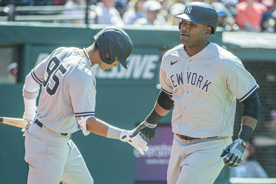 New York Yankees' Oswaldo Cabrera congratulates Franchy Cordero for his solo home run off Cleveland Guardians relief pitcher Trevor Stephan during the seventh inning of a baseball game in Cleveland, Wednesday April 12, 2023. (AP Photo/Phil Long)