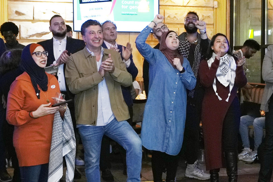 Supporters cheer as a speaker talks during an election night gathering, Tuesday, Feb. 27, 2024, in Dearborn, Mich. Some Democratic voters pledged to vote "uncommitted" in Tuesday's primary to let President Joe Biden know they aren't happy with his support for Israel in its response to the Oct. 7 attacks by Hamas. (AP Photo/Carlos Osorio)