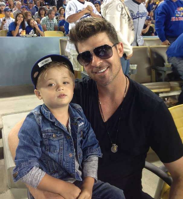 Robin Thicke loves to hang with his mini-me, Julian. (Photo: Los Angeles Dodgers via Getty Images)