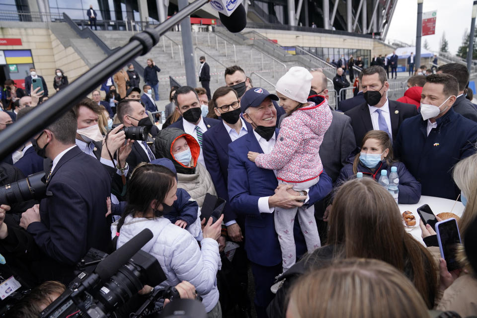 FILE - President Joe Biden meets with Ukrainian refugees and humanitarian aid workers during a visit to PGE Narodowy Stadium, on March 26, 2022, in Warsaw. The U.N. refugee agency says more than 4 million refugees have now fled Ukraine following Russia’s invasion, a new milestone in the largest refugee crisis in Europe since World War II. (AP Photo/Evan Vucci)