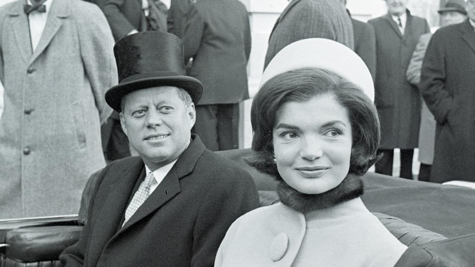 1917 - 1963) and First Lady Jacqueline Kennedy (nee Bouvier, later Onassis, 1929 – 1994) leave the capital building by car shortly after the former took the oath of office as President of the United States, Washington DC, January 20, 1961. President Kennedy, 43, the youngest man ever elected to the Presidency called for a global alliance against "Tyranny, Poverty, Disease, and War." President Kennedy took the oath of office at 12:51 P.M. Eastern, to become the 35th Chief Executive of the land.