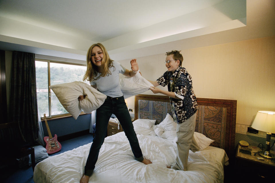 Actress Kirsten Dunst has a pillow fight with her younger brother Christian in a hotel room in Prague. The American actress is in town filming the Reverge Anselmo romance All Forgotten. (Photo by © Patrick Robert/Sygma/CORBIS/Sygma via Getty Images)