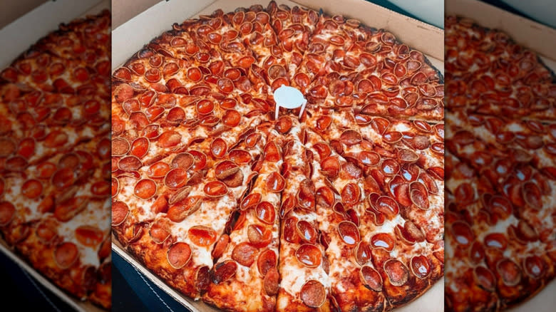 Sliced-up pepperoni pizza