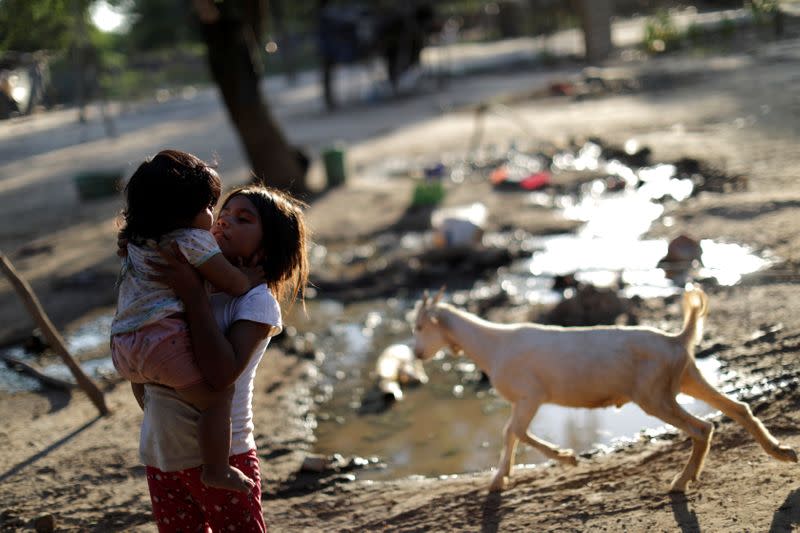 Children of the indigenous Wichi community are seen at a settlement, in the Salta province