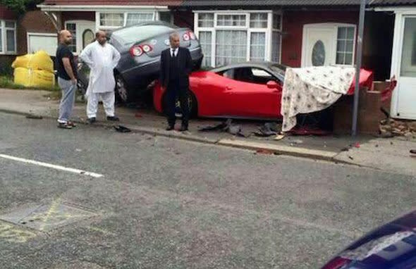 PLEASE NOTE UPDATED - MANDATORY - CREDIT INFORMATIONThis is the moment an unlucky driver crashed a Â£220,000 Ferrari hire car into a house - and UNDER a taxi. See SWNS story SWFERRARI; It is understood the driver had borrowed the Ferrari 458 for a family wedding when he smashed into the side of the terraced home in Luton, Bedfordshire, on Sunday night. Miraculously nobody was injured when the red and grey supercar hit a low brick wall, squeezing itself underneath a grey VW Passat taxi. Luxury car hire firm Prestige Lifestyle claim the motor - which had just 4,600 miles on the clock - belonged to them, and has now been written off.