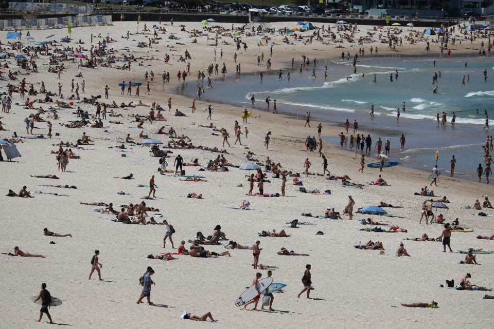 Beachgoers enjoy a sunny day at Bondi Beach despite growing concerns about the spread of the coronavirus disease (COVID-19) in Sydney, Australia, March 20, 2020.  REUTERS/Loren Elliott