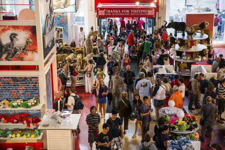 Crowds move around inside of the toy store FAO Schwarz on the last day that the store will be open in New York, July 15, 2015. REUTERS/Lucas Jackson