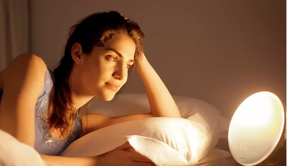 The SmartSleep Wake-Up Light Therapy Alarm Clock uses light and sound to wake you up. (Image via Amazon)