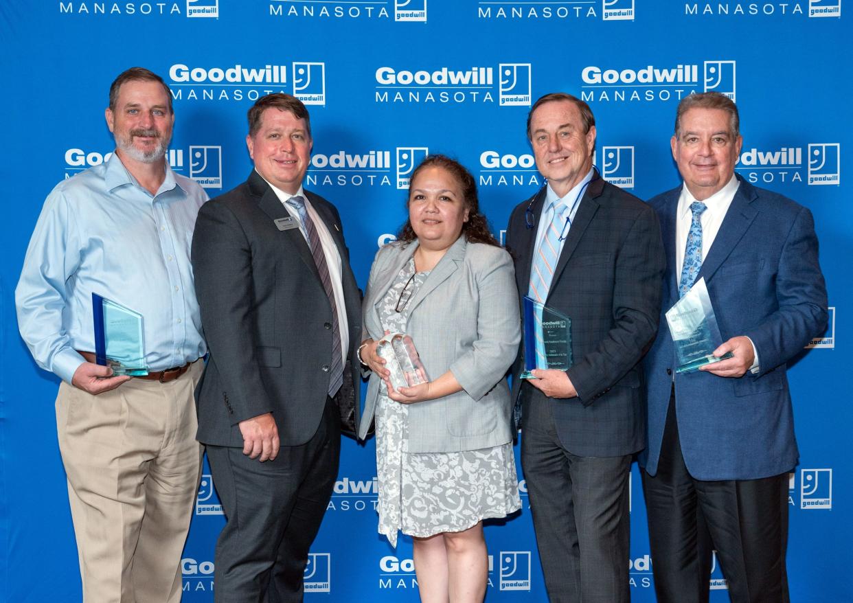 Goodwill Manasota president and CEO Donn Githens (second from left) joins Community Ambassador Awards honorees, from left, Rob Kehs, Dora Talamantes, Tom Waters and Bill Isaac.