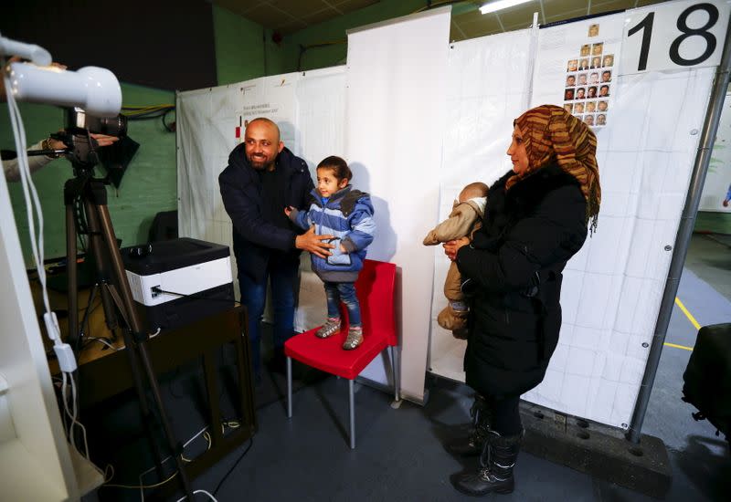 FILE PHOTO: Syrian refugees are being registered for the newly issued German Ankunftsnachweis in Herford