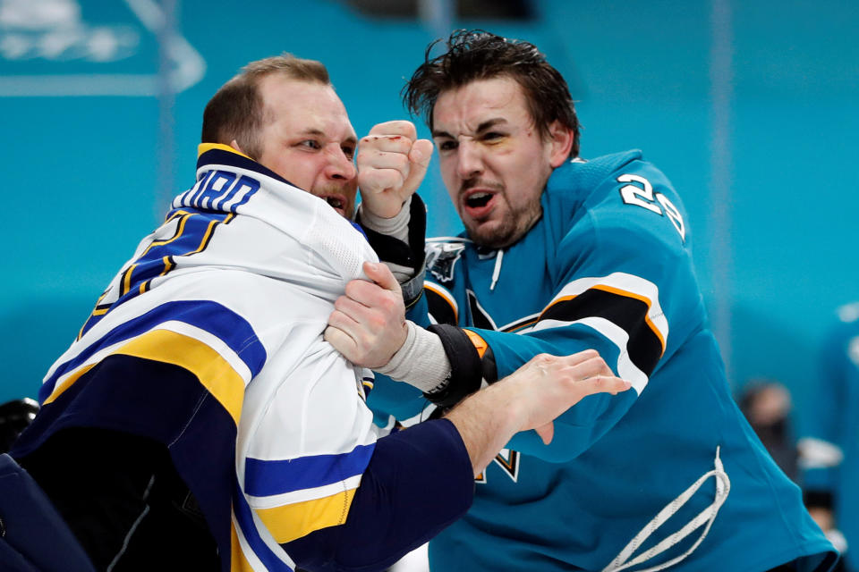 Mar 8, 2021; San Jose, California, USA; St. Louis Blues left wing Kyle Clifford (13) and San Jose Sharks right wing Kurtis Gabriel (29) fight during the first period at SAP Center at San Jose. Mandatory Credit: Darren Yamashita-USA TODAY Sports     TPX IMAGES OF THE DAY