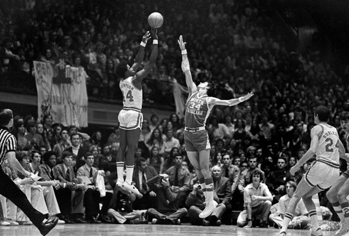 NC State’s David Thompson shoots over UNC’s Bobby Jones in action in Reynolds Coliseum in Raleigh, NC Feb. 26, 1974.